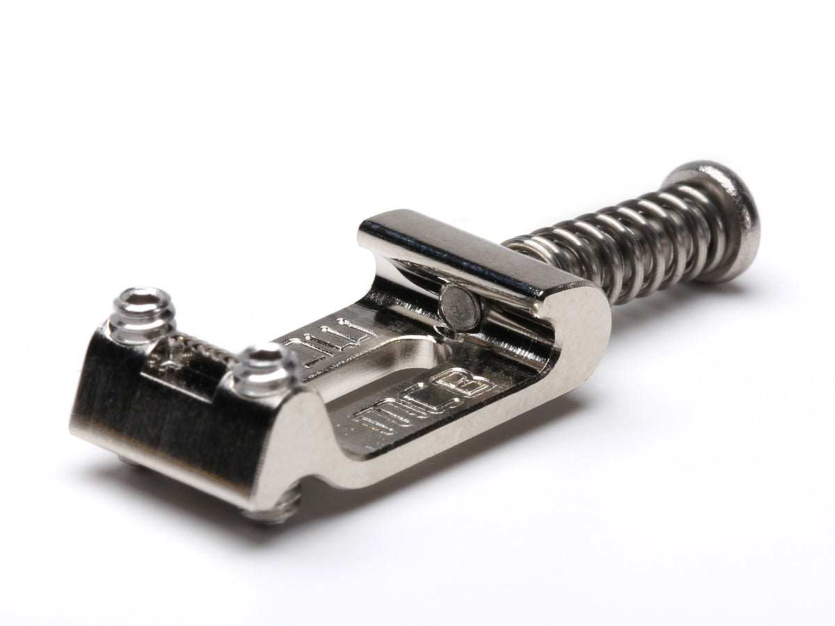 Close-up of a single Music City Bridge Groove Master Strat saddle with its intonation screw and spring