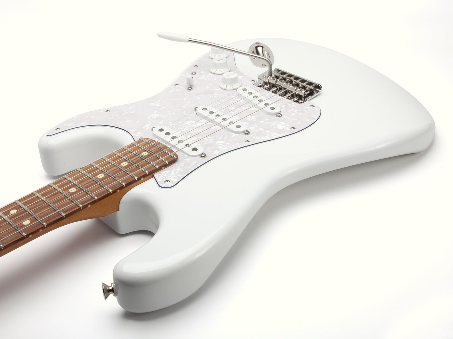 White electric guitar with a wooden fretboard on a white background