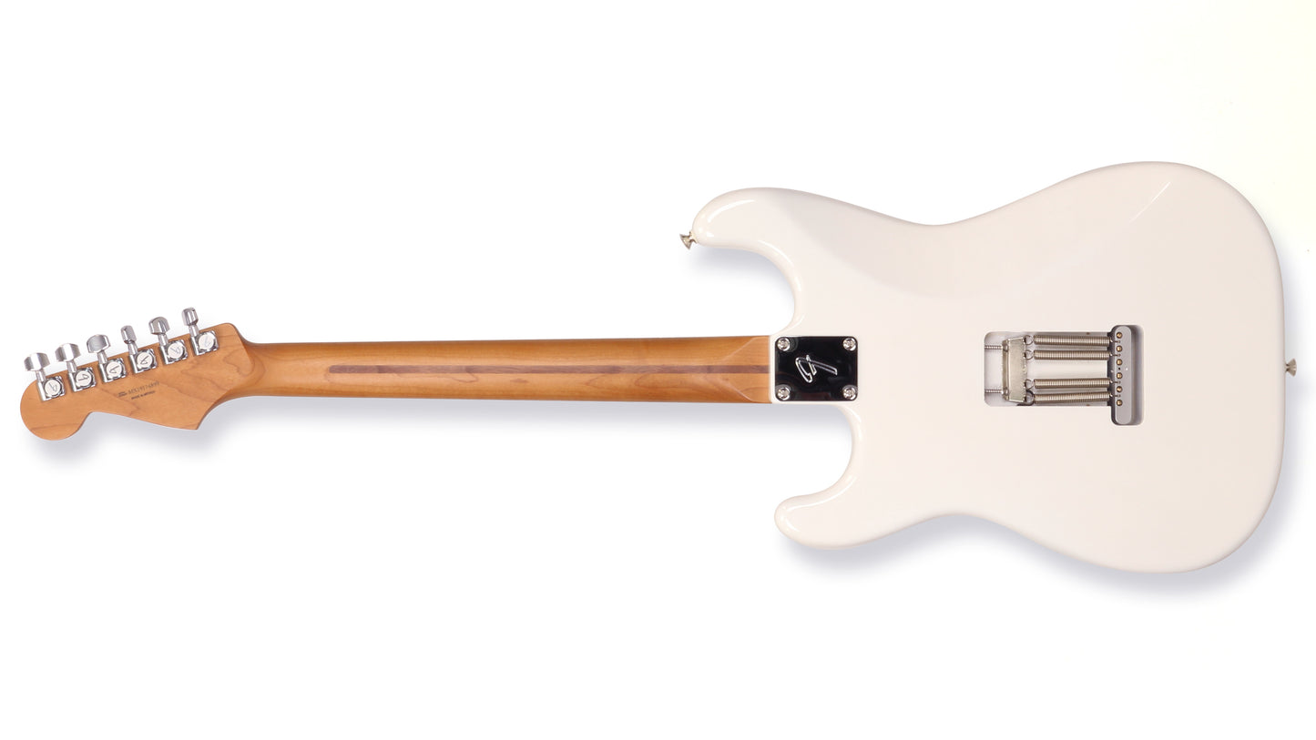 White electric guitar with a wooden neck on a white background