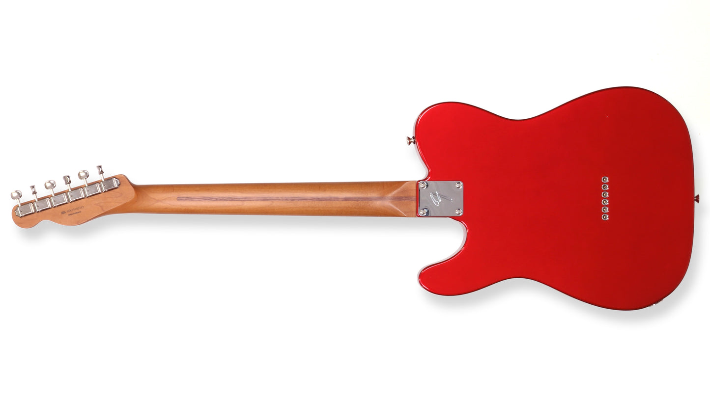 Red electric guitar on a white background